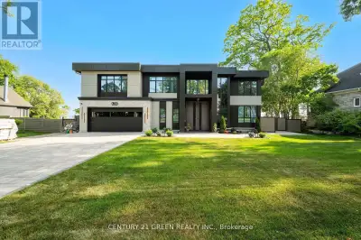 Lakefront newly custom-built home feels like a retreat, completed in November 2024, offering over 6,...
