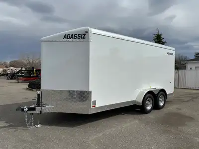 Agassiz 7x16 cargo trailer w/rear ramp door, and 2 5,200Lb torsion axles. Standard Options: Rubber T...