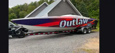 SPEED BOAT BATEAUX BAJA OUTLAW 36 PIEDS 2 MOTEUR 502-500HP AVEC PIEDS BRAVO XR TRAILER INCLU $60k DE...