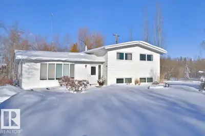 Beautiful 0.75 acre evergreen-lined property with an extensively updated 3-level split offering appr...