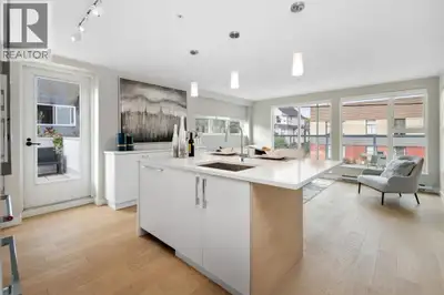 This beautifully finished air conditioned end-unit townhome spans four levels and boasts elegant Car...