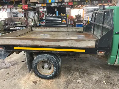 Flatbed with ramp for pickup truck.
