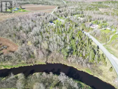 Discover the perfect blend of privacy and convenience with this beautiful treed 2.3-acre lot overloo...