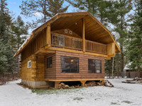 Log Home Chalet style waterfront for sale.