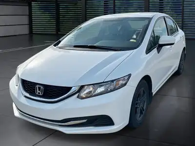 The 2014 Honda Civic Sedan LX, in a pristine white finish and equipped with a smooth front-wheel-dri...