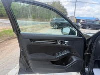 A modern and efficient compact sedan with a refined interior, advanced safety features, and smooth t... (image 6)