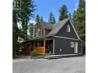 Cottage charm meets modern mountain living in this beautifully finished home nestled on a large, tre...