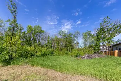R06//Ste Anne/Beautiful treed building lot on Seine River Crossing, walking distance to park and riv...