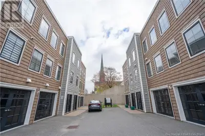 This fantastic 2-level corner unit condo offers plenty of space and natural light throughout. The ma...