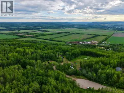 15.4 acres offering an incredible panoramic view from the top to both the east and west from desirab...