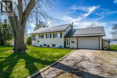 Enjoy waterfront living on the south shore of Hay Bay in this well-maintained elevated bungalow. Thi...
