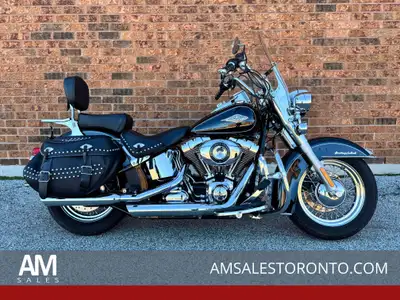 Beautiful Canadian Heritage Softail with passenger backrest and luggage rack, slash cut performance...