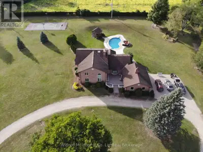 Nestled on the edge of Wingham, Ontario, this 6-plus-acre estate on a quiet country road offers a pr...