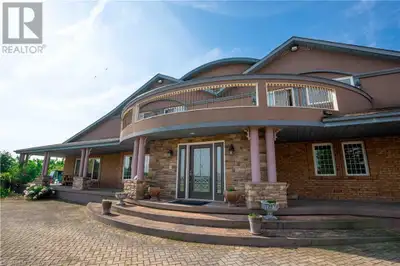 An Unparalleled Estate of Elegance and Prestige! Perched atop 4.94 acres of pristine landscape, this...