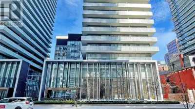 Welcome home to this exceptional corner suite, where breathtaking city and lake views unfold across...