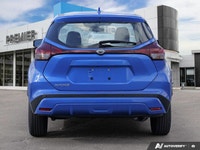Navigate city streets with confidence and style in the 2022 Nissan Kicks S, striking in Electric Blu... (image 4)