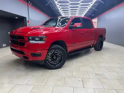 Introducing the 2022 Ram 1500 Sport, draped in a stunning red finish and powered by a robust 4x4 dri...