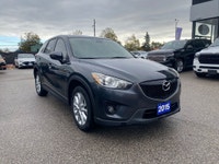 This 2015 Mazda CX-5 GT AWD is a sporty crossover that's smoother than a twisty backroad and comfier... (image 4)