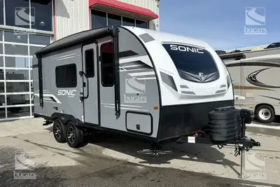 The 2024 Venture RV Sonic 190VRB is a sleek travel trailer in a striking Aztec grey fibreglass exter...