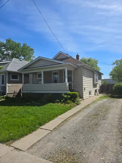 An updated duplex on a quiet street. Owner lives in basement and retains private use of back yard. T...