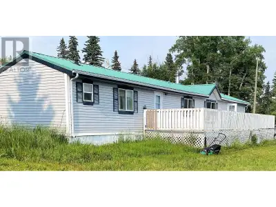 This 2006 manufactured home sits on its own land, the property is three separately titled small lots...