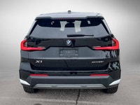 The 2025 BMW X1 xDrive28i arrives as a striking black Sport Utility vehicle, seamlessly blending ath... (image 5)