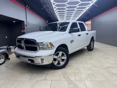 Get ready to own the roads with the stunning 2023 Ram 1500 Classic SLT 4x4 Crew Cab in a pristine wh...