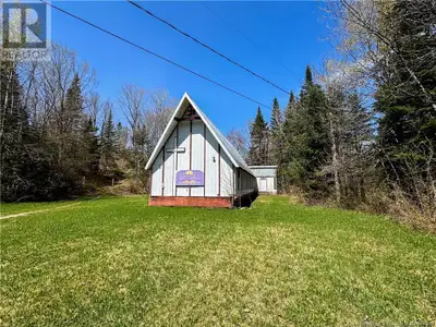 Nestled on 5.93 acres along the Muniac Stream in Kincardine, New Brunswick, this unique property off...