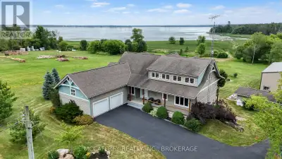 Welcome to your dream home on the shores of Hay Bay! This custom-built two-story masterpiece, constr...