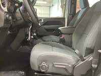 The 2026 Jeep Wrangler Sport 2 Door 4x4, presented in a striking white color, is equipped with a res... (image 9)
