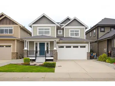 6 bedroom, 4 full bathroom basement entry home on a quiet family-oriented street surrounded by newer...