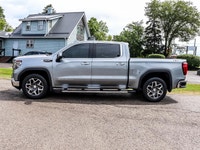 The 2023 GMC Sierra 1500 SLT Crew Cab Short Box 4-Wheel Drive in a refined gray finish offers except... (image 4)