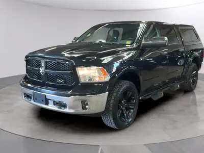 Step into the command of the 2015 Ram 1500 Outdoorsman with its rugged black exterior and powerful 4...