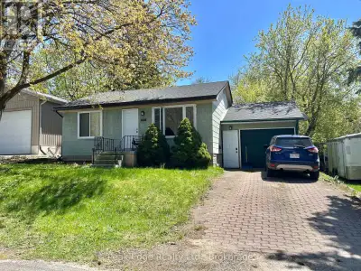 Check out this updated two-bedroom bungalow with an attached garage. This is an ideal opportunity fo...