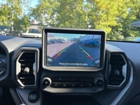 The 2023 Ford Bronco Sport Big Bend in a striking gray finish is an adventure-ready SUV with a power... (image 9)