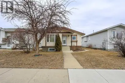 FULLY DEVELOPED BUNGALOW ~ 4 BEDROOMS, 2 BATHROOMS ~ DOUBLE DETACHED GARAGE ~ Mature landscaping and...
