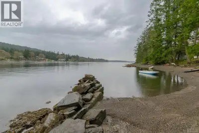 Exceptional 6.04-acre waterfront property offers a rare opportunity for those seeking a private retr...