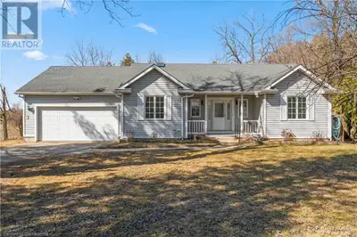Welcome to your dream home! Nestled on a serene .67-acre lot, this custom-built bungalow offers the...