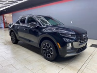 The 2023 Hyundai Santa Cruz Preferred AWD in sleek black offers an extraordinary driving experience... (image 2)