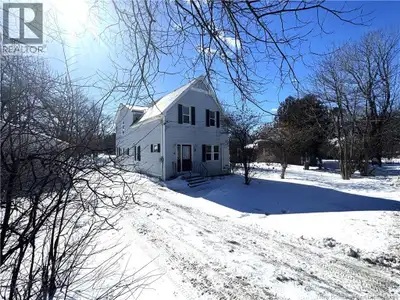 Situated on a large, mature lot in Barker's Point, this picture-perfect home is larger than it appea...