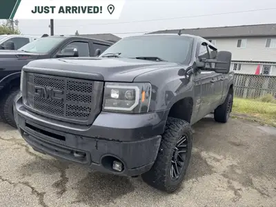 Experience the power and rugged capability of the 2010 GMC Sierra 2500HD SLT, presented in a command...