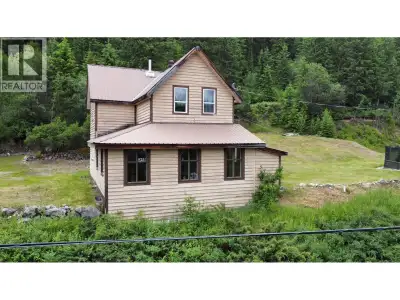 Beautiful turn of the century home! This home features a large open concept living space with loads...