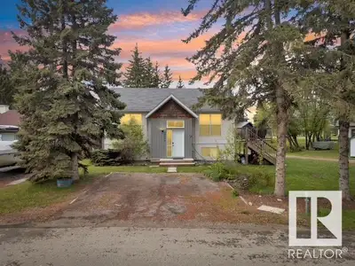 WELCOME TO SYLVAN LAKE This exquisite corner lot home offers eye-sight scenes views to the beautiful...