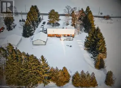 Located on RARE 150x250 ft lot at 858 Trinity Road South in Ancaster, this spacious custom bungalow...