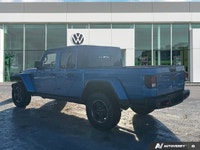 Conquer every landscape in this 2023 Jeep Gladiator Rubicon, gleaming in Hydro Blue Pearl. With only... (image 2)