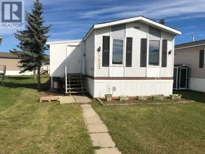 Located in Cheviot Heights mobile home park on Peace River’s west hill, this 1285 sq.ft. mobile is r...