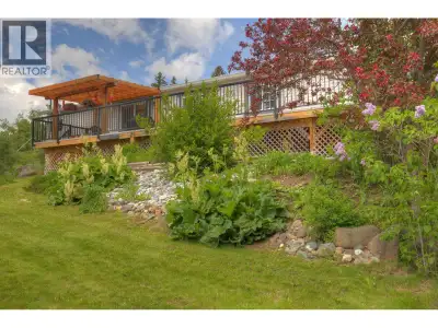 Immaculate rancher with South-facing waterfront on Rose Lake! This enchanting lakefront home offers...