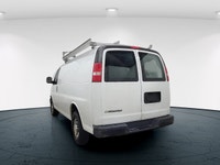 The 2017 Chevrolet Express Cargo Van in a classic white, rear-wheel drive design is tailored for tho... (image 5)