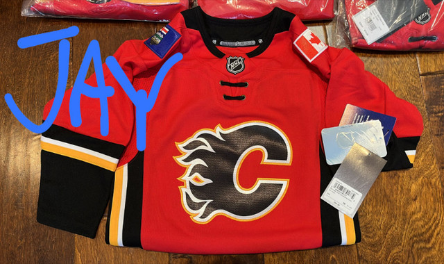 Brand New in Bag w/ TAGS Calgary Flames NHL Jersey for all ages in Women's - Tops & Outerwear in Calgary - Image 3