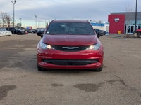 The 2026 Chrysler Grand Caravan SXT in Red Hot Pearl with a Black interior combines style, comfort,... (image 9)